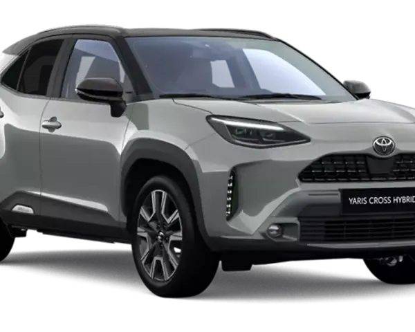 Srebrny Toyota Yaris Cross Hybrid z czarnym dachem, prezentujący nowoczesny design i hybrydowy napęd.